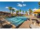 Large community pool with ample seating and well maintained landscape at 6255 W Arby Ave # 183, Las Vegas, NV 89118