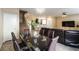 Open dining and living space featuring modern decor, ample lighting, and tile floors at 6255 W Arby Ave # 183, Las Vegas, NV 89118
