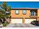 Two-story home featuring a two-car garage and manicured landscaping at 6255 W Arby Ave # 183, Las Vegas, NV 89118