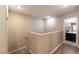 Bright hallway leading to a bathroom with warm tones and wood-look flooring at 6255 W Arby Ave # 183, Las Vegas, NV 89118
