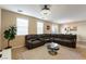 Spacious living room featuring a modern sectional sofa and decorative rug at 6255 W Arby Ave # 183, Las Vegas, NV 89118