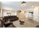 Open concept living space with adjacent kitchen, dining area, and modern decor at 6255 W Arby Ave # 183, Las Vegas, NV 89118