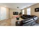 Comfortable living room featuring a modern sectional sofa and a wall-mounted TV at 6255 W Arby Ave # 183, Las Vegas, NV 89118