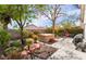 Relaxing backyard features a hot tub surrounded by lush landscaping and a concrete patio at 653 Freeburg Pl, Las Vegas, NV 89123