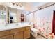 Bright bathroom featuring a spacious vanity and decorative floral shower curtain at 653 Freeburg Pl, Las Vegas, NV 89123