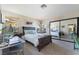 Cozy bedroom with natural light, a sliding mirror closet and a dedicated workspace at 653 Freeburg Pl, Las Vegas, NV 89123