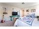 Bedroom with a comfortable bed, TV set, and a workspace area at 653 Freeburg Pl, Las Vegas, NV 89123