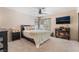 Comfortable bedroom with ceiling fan and media center at 653 Freeburg Pl, Las Vegas, NV 89123