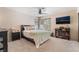 Comfortable bedroom with ceiling fan and media center at 653 Freeburg Pl, Las Vegas, NV 89123