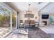 Cozy dining area with backyard access is open to a living room with fireplace at 653 Freeburg Pl, Las Vegas, NV 89123