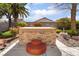 Close-up of the hot tub with decorative stone exterior and built-in seating on the patio at 653 Freeburg Pl, Las Vegas, NV 89123
