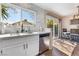 Kitchen area featuring stainless steel appliances, modern countertops and a sunny window at 653 Freeburg Pl, Las Vegas, NV 89123