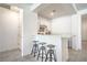 Stylish wet bar with seating and storage at 6593 Corsari Ridge St, Las Vegas, NV 89166