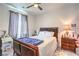 Bedroom featuring a bed, ceiling fan, and ample natural light at 6593 Corsari Ridge St, Las Vegas, NV 89166
