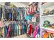 Walk-in closet featuring built-in shelving, hanging rods, and organized storage solutions at 6593 Corsari Ridge St, Las Vegas, NV 89166