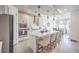 Open kitchen featuring a large island, stainless steel appliances, and modern pendant lighting at 6593 Corsari Ridge St, Las Vegas, NV 89166