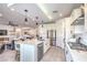 Spacious kitchen with stainless appliances, an island, and an open floor plan at 6593 Corsari Ridge St, Las Vegas, NV 89166