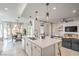 Open kitchen area with island, view of dining and living spaces at 6593 Corsari Ridge St, Las Vegas, NV 89166
