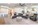 Open-concept living room showcasing modern design elements and comfortable furnishings at 6593 Corsari Ridge St, Las Vegas, NV 89166