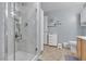 Modern bathroom featuring a walk-in shower with a glass door, light grey walls, and a functional vanity at 6680 Abruzzi Dr # 102, North Las Vegas, NV 89084