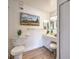 Bright bathroom with a modern vanity, stylish decor and wood-look floors at 725 N Royal Crest Cir # 227, Las Vegas, NV 89169