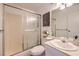 Cozy bathroom featuring a glass shower, bright lighting and neutral color palette at 725 N Royal Crest Cir # 227, Las Vegas, NV 89169