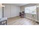 Spacious bedroom with modern floors, ample natural light, and closet with sliding doors at 725 N Royal Crest Cir # 227, Las Vegas, NV 89169