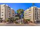 Attractive condominium complex with manicured landscaping and mature trees at 725 N Royal Crest Cir # 227, Las Vegas, NV 89169