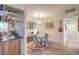 Chic dining area with a glass table, stylish chairs, and a view into the kitchen at 725 N Royal Crest Cir # 227, Las Vegas, NV 89169