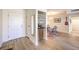 Inviting entryway featuring a wet bar, a modern light fixture, and a view into the dining area at 725 N Royal Crest Cir # 227, Las Vegas, NV 89169