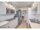 Modern kitchen with stainless steel appliances, including a microwave and refrigerator at 725 N Royal Crest Cir # 227, Las Vegas, NV 89169