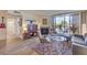 Cozy living room with a fireplace, comfortable seating, and a sliding glass door to a balcony at 725 N Royal Crest Cir # 227, Las Vegas, NV 89169