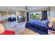 Spacious main bedroom with ceiling fan, large window, and mirrored closet doors at 725 N Royal Crest Cir # 227, Las Vegas, NV 89169