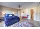 Well-appointed main bedroom with stylish decor, including a decorative rug and ceiling fan at 725 N Royal Crest Cir # 227, Las Vegas, NV 89169