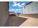 Wide angle shot of the spacious backyard featuring privacy walls and gravel landscaping at 7255 Bold Rock Ave, Las Vegas, NV 89113