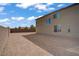 Large backyard with privacy wall and dirt landscaping at 7255 Bold Rock Ave, Las Vegas, NV 89113