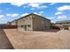 Spacious backyard showing the home's exterior and privacy wall at 7255 Bold Rock Ave, Las Vegas, NV 89113