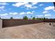 Backyard features a high block wall for privacy at 7255 Bold Rock Ave, Las Vegas, NV 89113