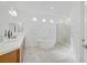 Spa-like bathroom featuring a freestanding tub, glass shower, and double vanity at 7255 Bold Rock Ave, Las Vegas, NV 89113