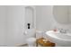 Chic powder room showcasing a decorative niche and contemporary fixtures at 7255 Bold Rock Ave, Las Vegas, NV 89113