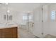 Modern bathroom features a double vanity, soaking tub, and glass shower at 7255 Bold Rock Ave, Las Vegas, NV 89113