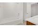 Modern bathroom features a tub/shower combo and single sink at 7255 Bold Rock Ave, Las Vegas, NV 89113