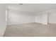 Bedroom featuring neutral carpet, white walls, and natural light from the window at 7255 Bold Rock Ave, Las Vegas, NV 89113