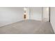 Spacious carpeted bedroom leading to bathroom and closet at 7255 Bold Rock Ave, Las Vegas, NV 89113