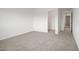 Bedroom featuring neutral carpet and access to a closet, offering a comfortable and organized living space at 7255 Bold Rock Ave, Las Vegas, NV 89113