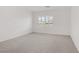Bright carpeted bedroom with neutral walls and plantation shutters at 7255 Bold Rock Ave, Las Vegas, NV 89113