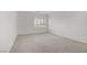 Bright carpeted bedroom with plantation shutters providing natural light at 7255 Bold Rock Ave, Las Vegas, NV 89113