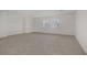 Large bonus room with neutral carpet and ample space for customization at 7255 Bold Rock Ave, Las Vegas, NV 89113