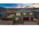 Elegant two-story home with a three-car garage and mountain views at sunset at 7255 Bold Rock Ave, Las Vegas, NV 89113