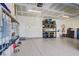 Garage with epoxy floor, shelving, water filtration system, sink, and ample storage at 7255 Bold Rock Ave, Las Vegas, NV 89113
